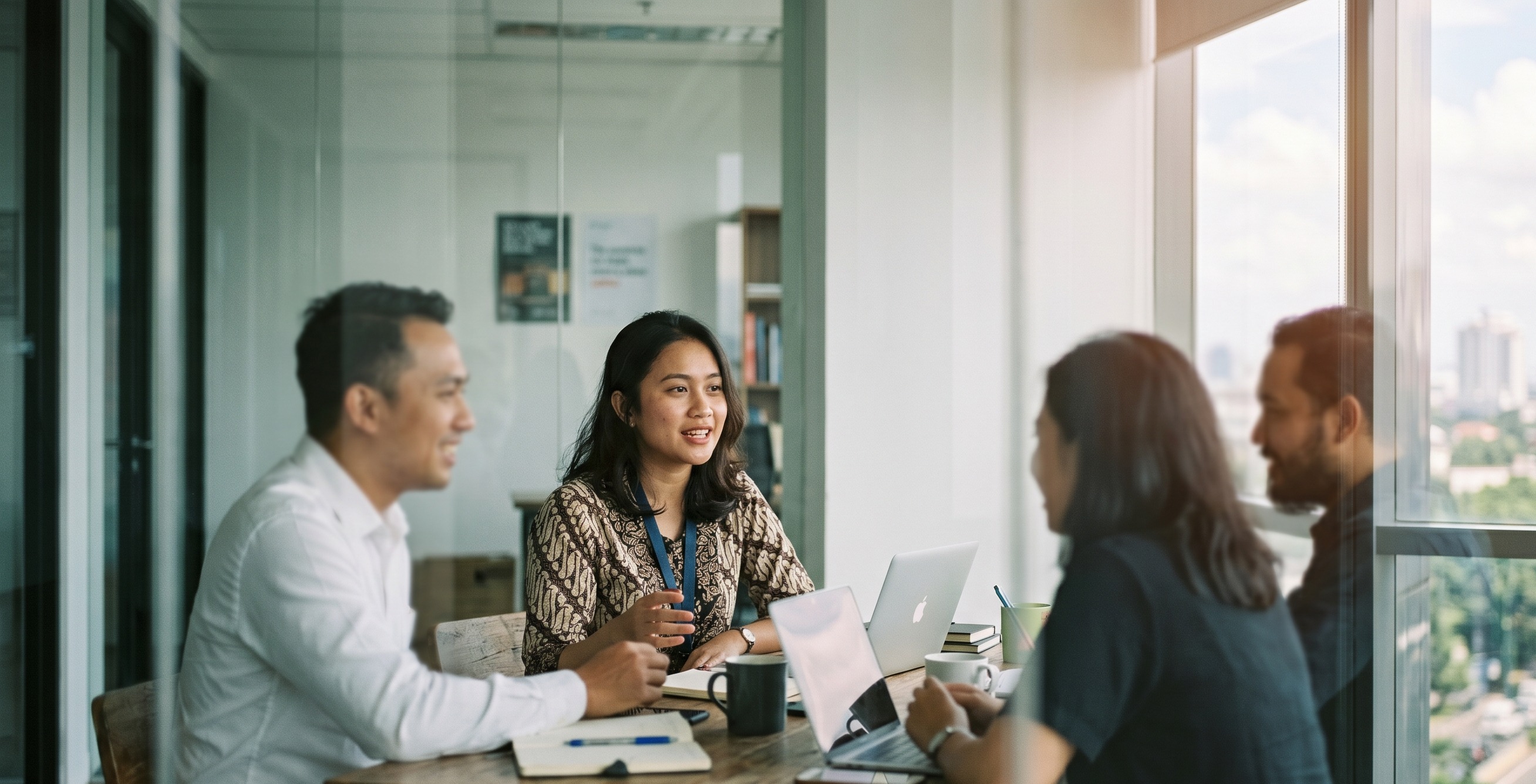 Majapahit Group advisors in a collaborative strategy session at a Jakarta office — cross-border advisory built on intellectual rigour and market expertise